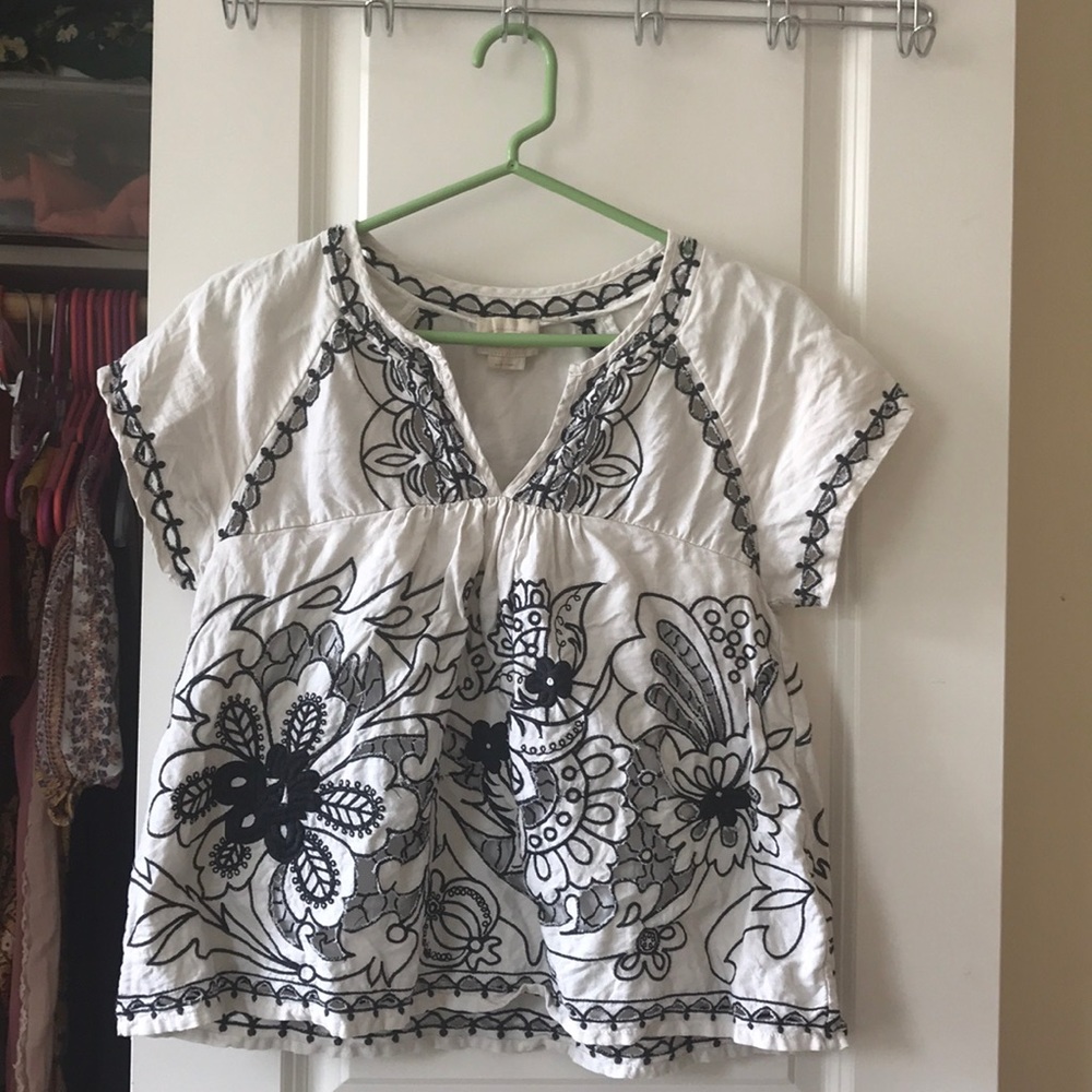 I am selling a hand-embroidered Anthropologie top